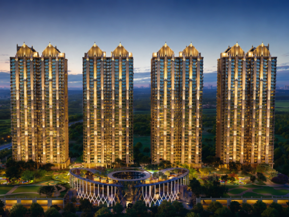 Gaur Alaris by Gaurs Group luxury high-rise residential towers night view with illuminated podium deck