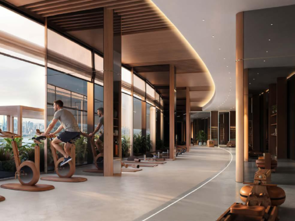 Modern indoor fitness gym with luxury wooden exercise cycles at Binghatti Wraith Al Jaddaf