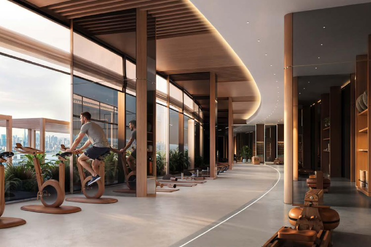 Modern indoor fitness gym with luxury wooden exercise cycles at Binghatti Wraith Al Jaddaf