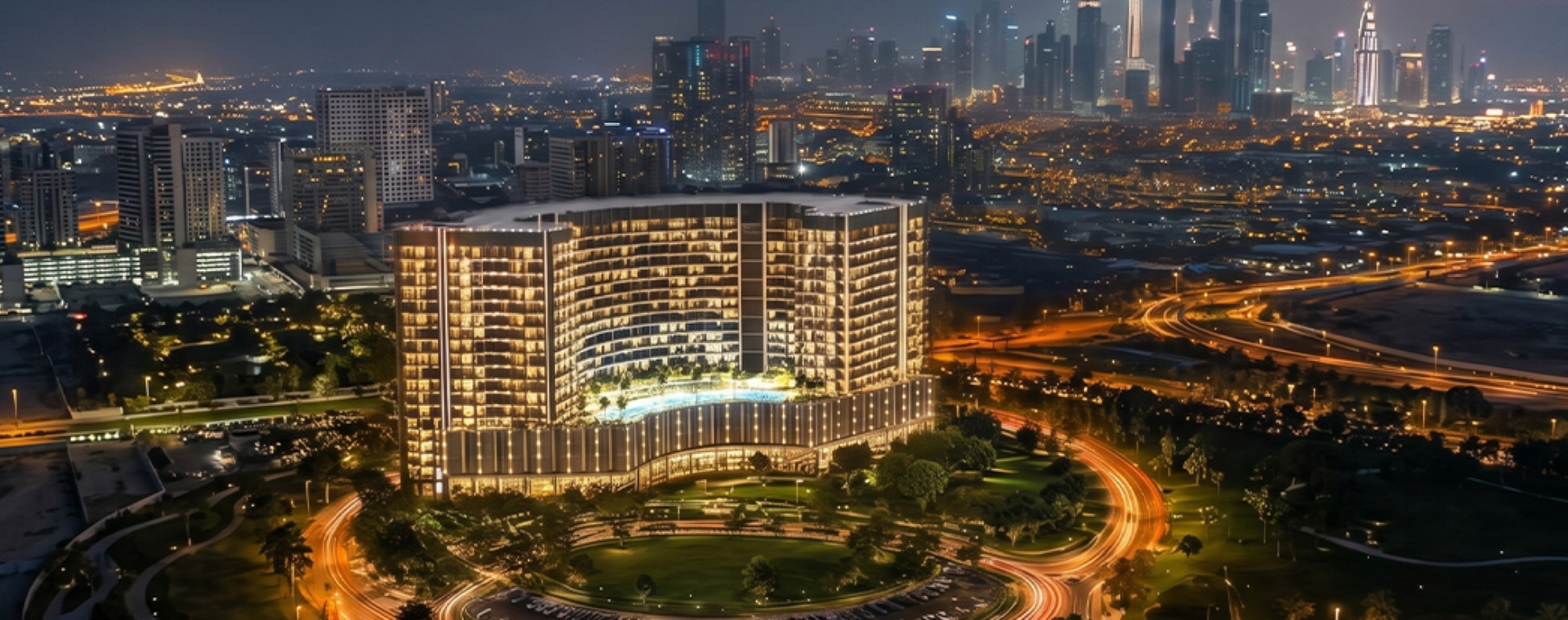 Aerial night view of Binghatti Wraith Al Jaddaf apartment building with Dubai skyline